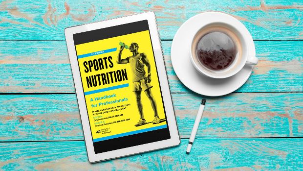 Sports Nutrition: A Handbook for Professionals, 6th Ed. on a tablet screen, with the tablet lying on a desk.