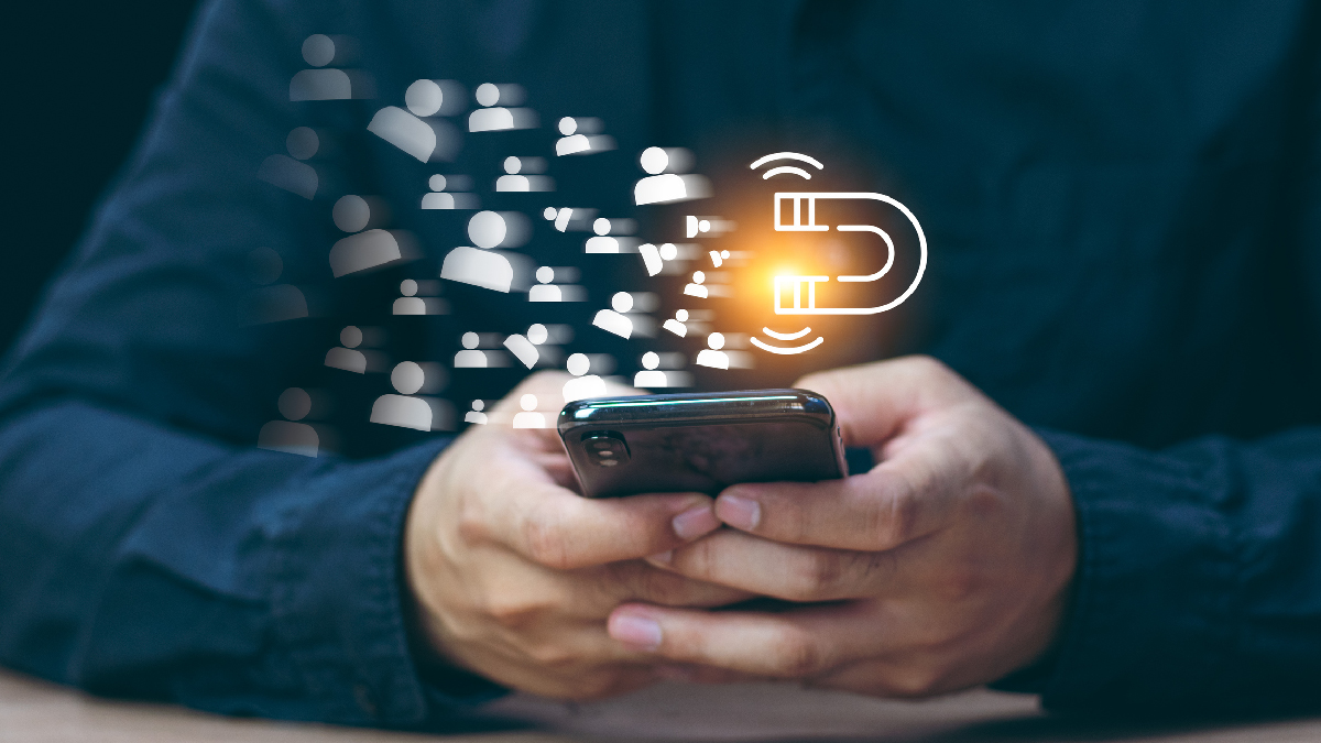 Adapting Nutrition Practice to Capture and Maintain Gen Z and Young Adult Clients | Person playing with phone while sitting at table