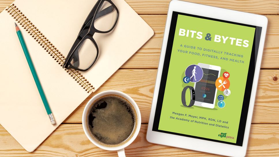 Bits and Bytes: A Guide to Digitally Tracking Your Food, Fitness, and Health on a tablet screen, with the tablet lying on a desk.