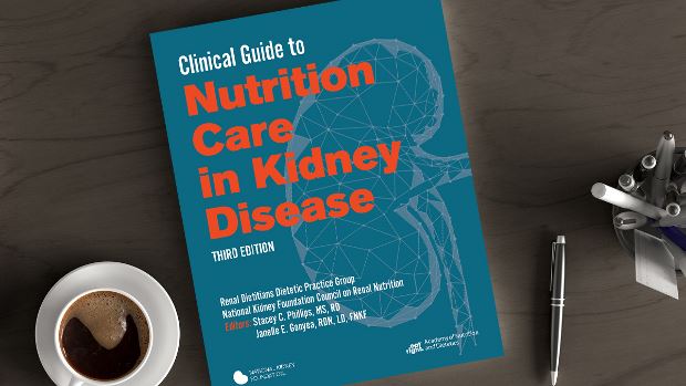 Copy of Clinical Guide to Nutrition Care in Kidney Disease, 3rd Ed. lying on a desk.
