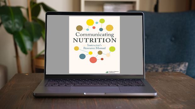 Copy of Communicating Nutrition: The Authoritative Guide Instructors Resource Kit lying on a desk.