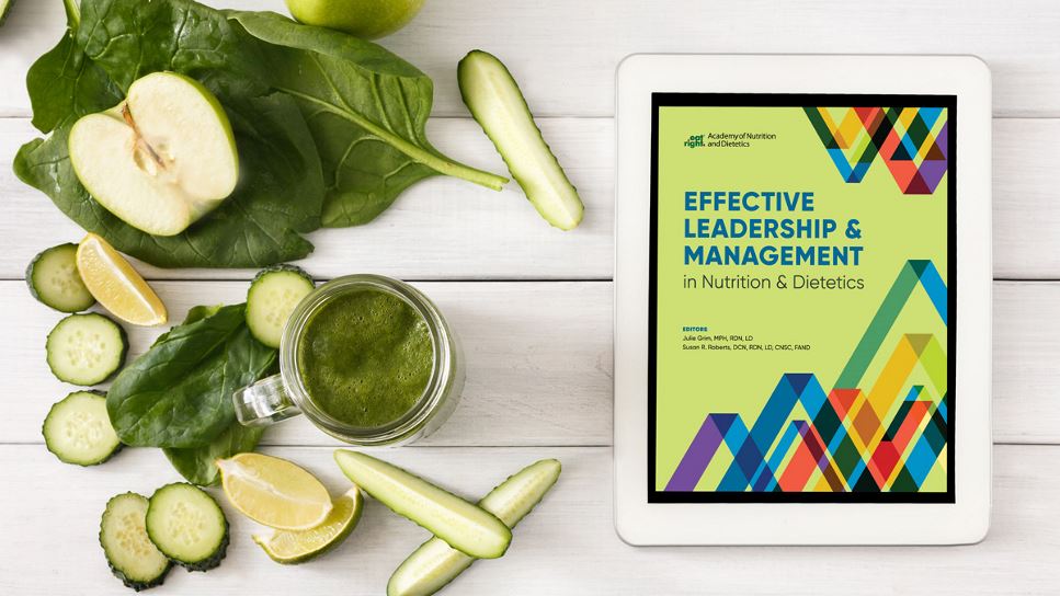 Effective Leadership & Management in Nutrition & Dietetics on a tablet screen, with the tablet lying on a desk.