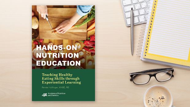 Copy of Hands-On Nutrition Education: Teaching Healthy Eating Skills Through Experiential Learning lying on a desk.