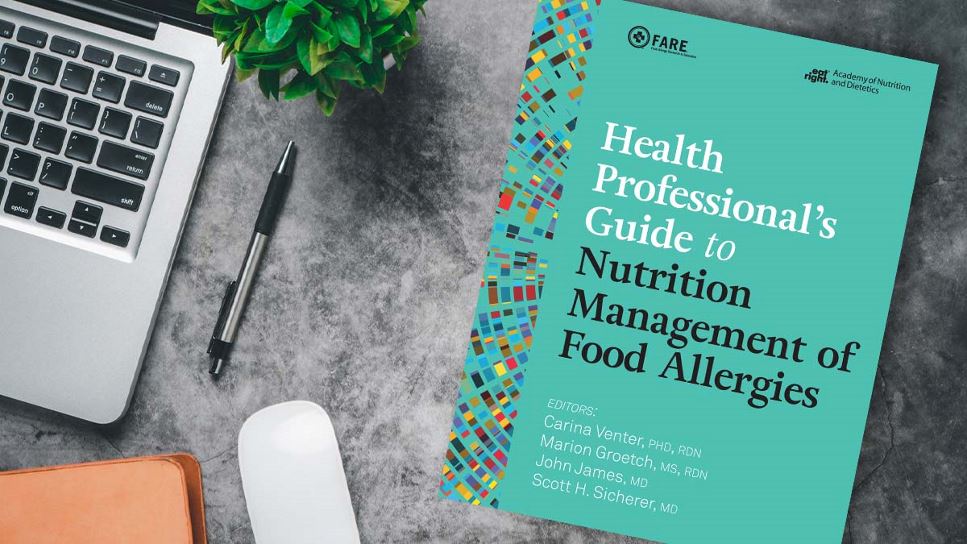Copy of Health Professional's Guide to Nutrition Management of Food Allergies lying on a desk.