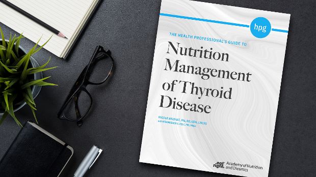 Copy of Health Professional's Guide to Nutrition Management of Thyroid Disease lying on a desk.