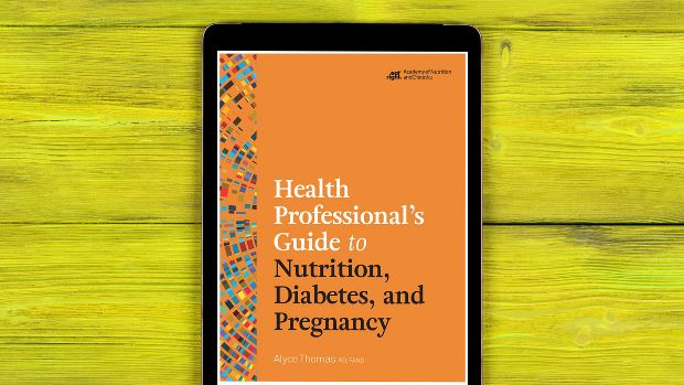 Health Professional's Guide to Nutrition, Diabetes, and Pregnancy on a tablet screen, with the tablet lying on a desk.