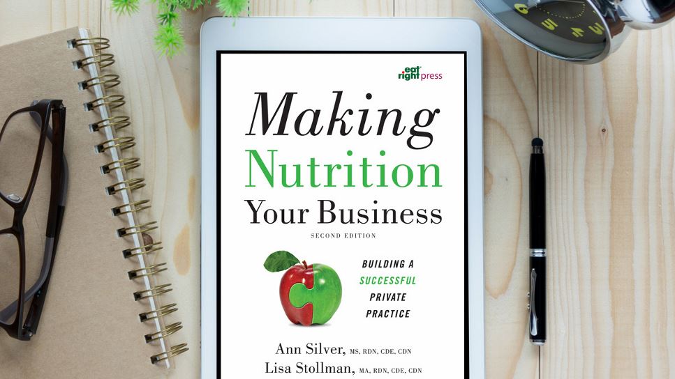 Making Nutrition Your Business, 2nd Ed. on a tablet screen, with the tablet lying on a desk.
