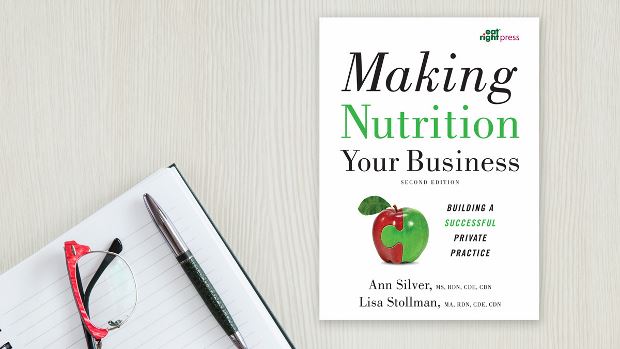 Copy of Making Nutrition Your Business, 2nd Ed. lying on a desk.