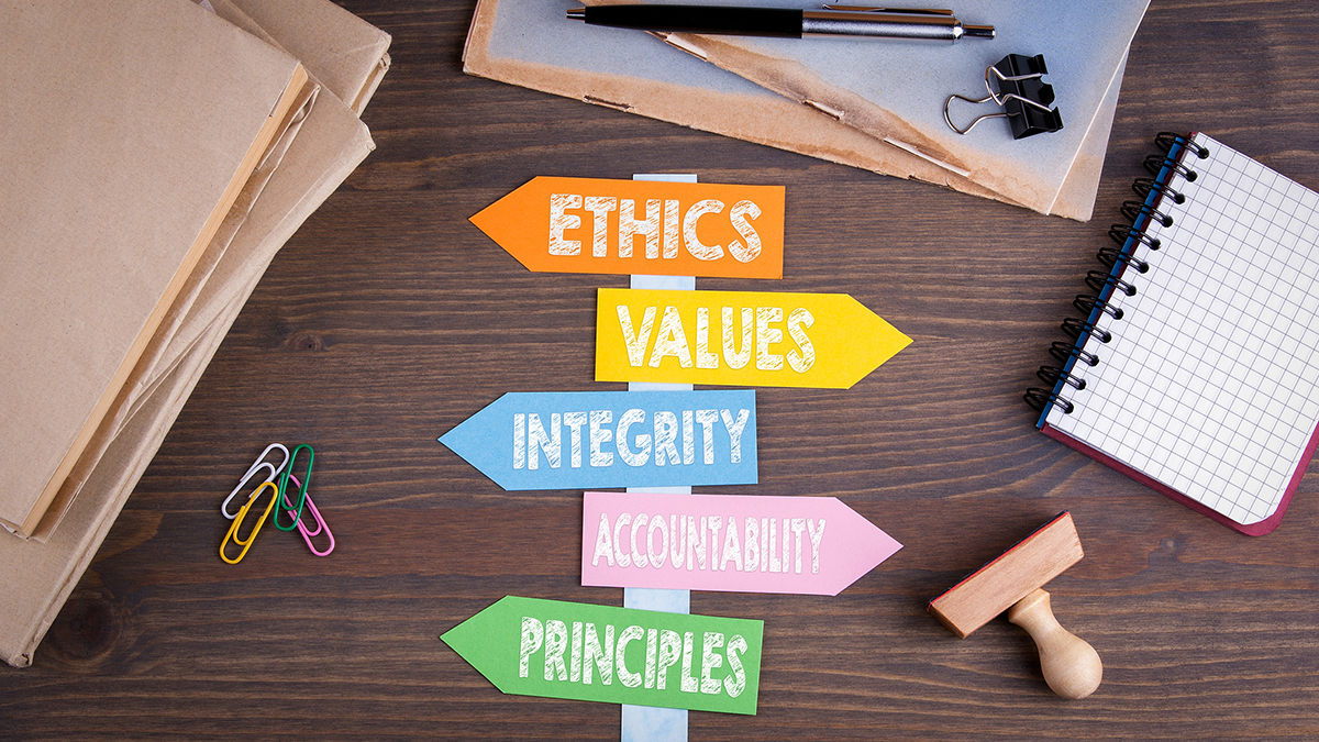 Understanding Mandatory Reporting & Your Role in Identifying and Protecting Vulnerable Individuals | Paper signpost on a wooden desk with Ethics, Values, Integrity, Accountability, and Principles signs 