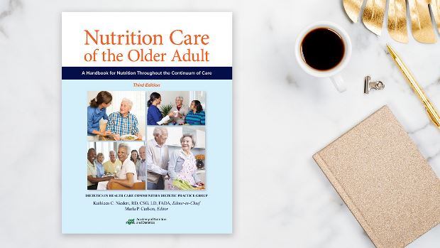 Copy of Nutrition Care of the Older Adult, 3rd Ed. lying on a desk.