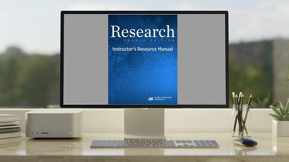 Copy of Research, 4th Ed. Instructor's Resource Kit lying on a desk.