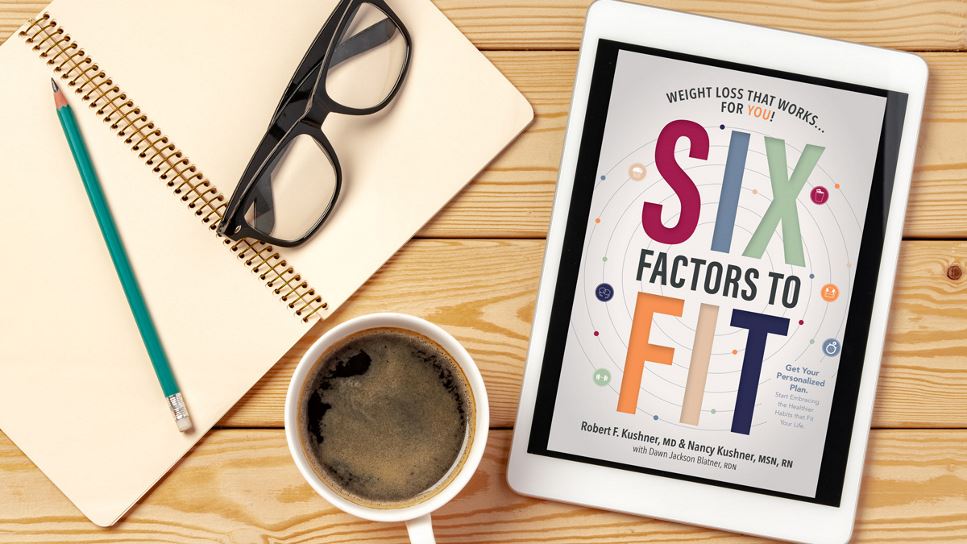 Six Factors to Fit: Weight Loss That Works for You! on a tablet screen, with the tablet lying on a desk.