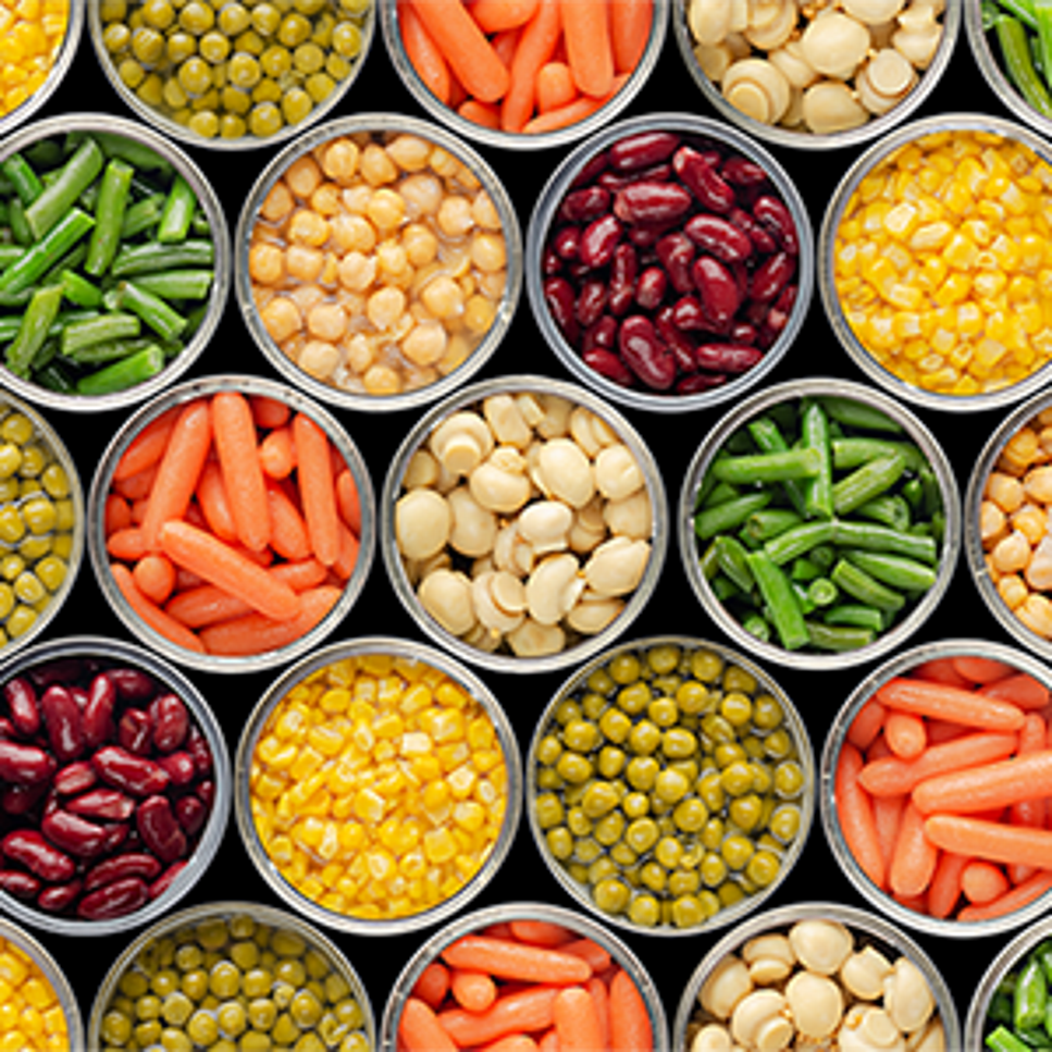 Open cans of vegetables seen from above.