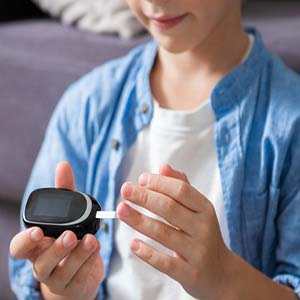 A child checking their insulin