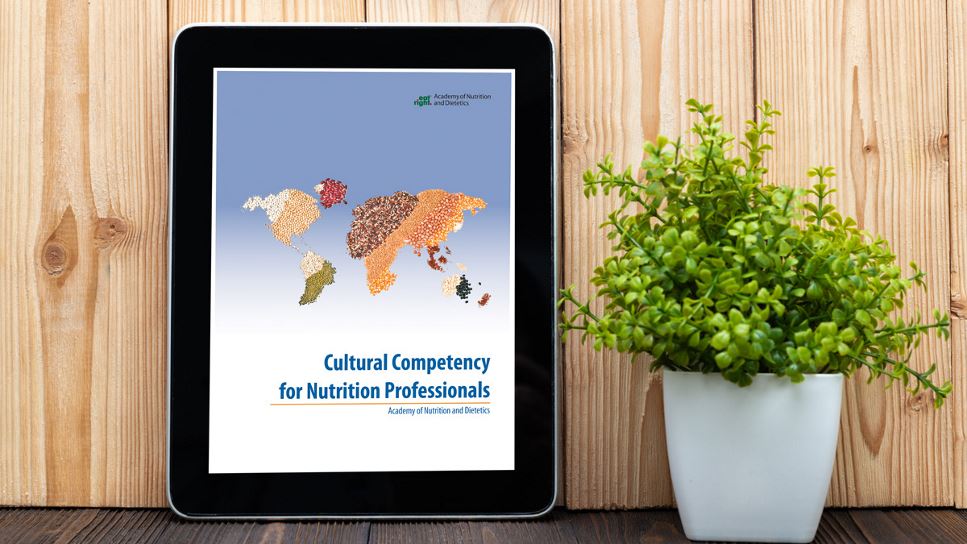 Cultural Competency for Nutrition Professionals on a tablet screen, with the tablet lying on a desk.